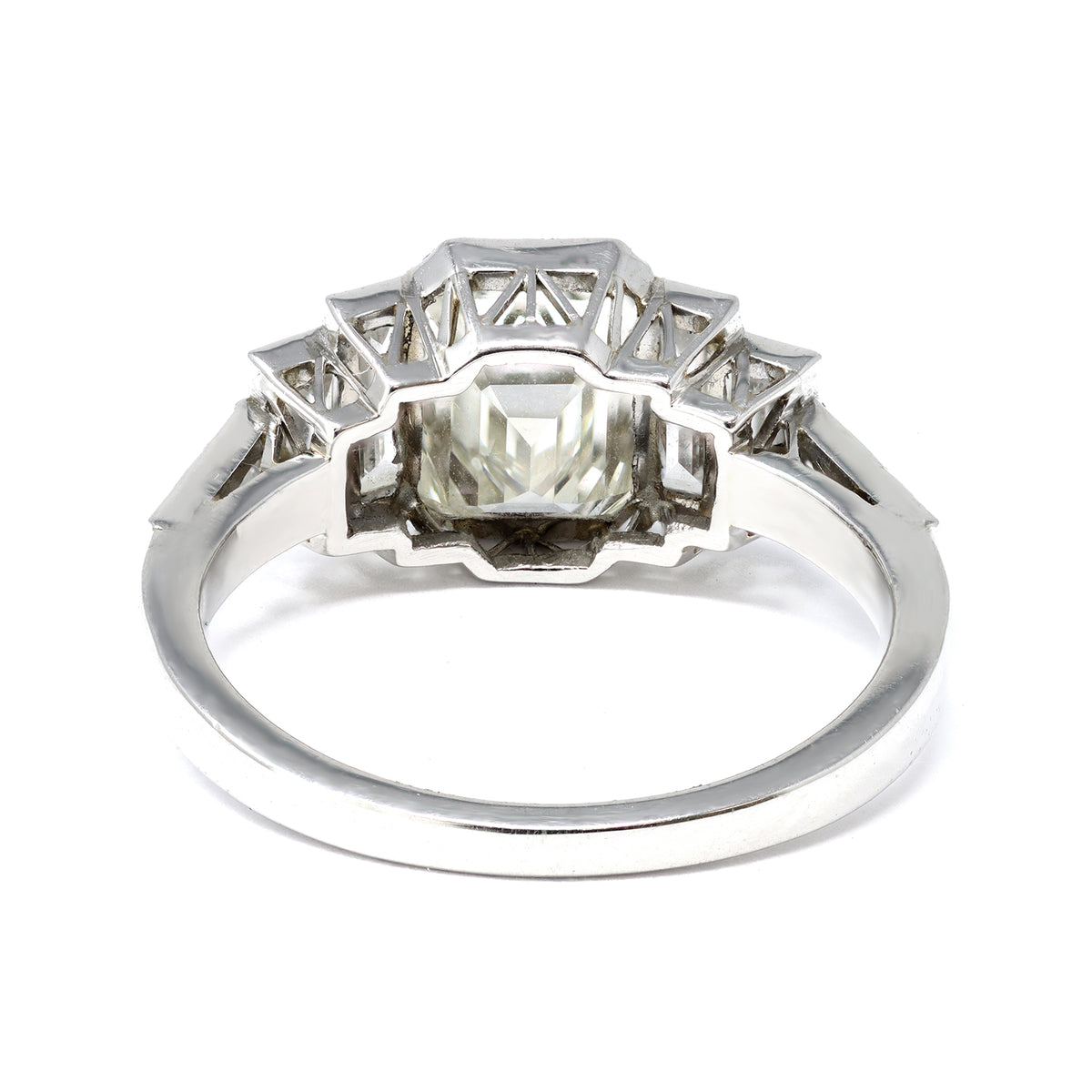 An Elegant Emerald-cut Diamond Ring with side baguettes set in Platinum galleria view