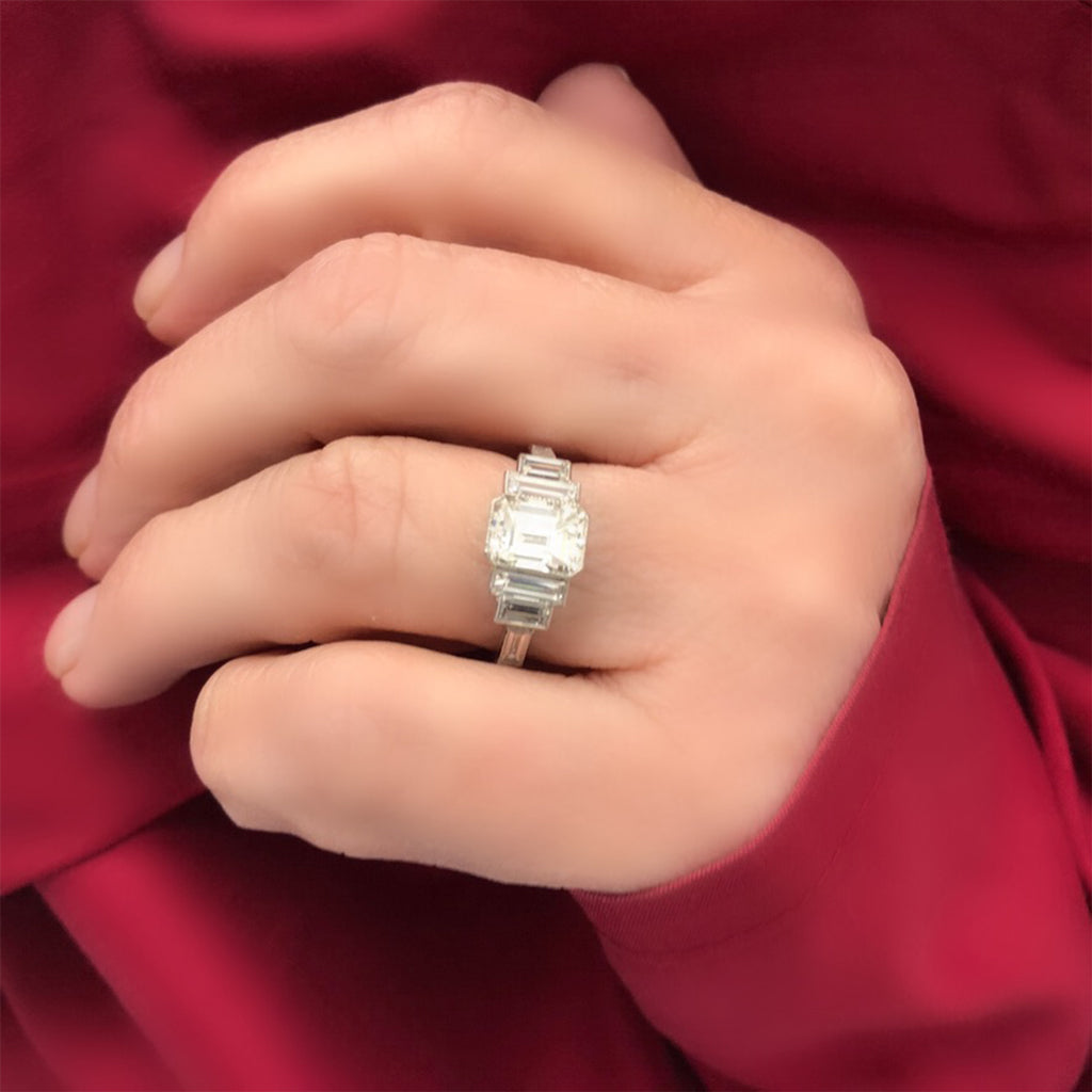 An Elegant Emerald-cut Diamond Ring with side baguettes set in Platinum model view