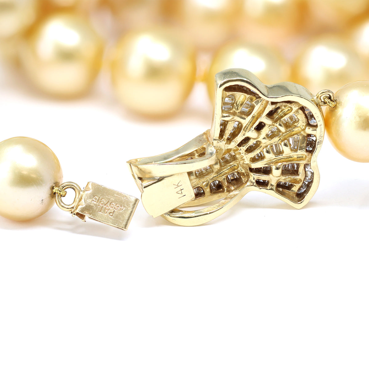natural south sea gold pearl necklace with 14 karat yellow gold diamond clasp detail view
