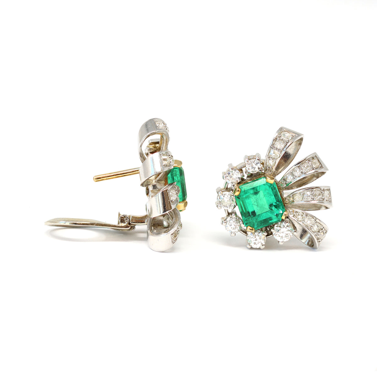 Pair of Emerald and Diamond Clip on Earrings in Platinum, Circa 1940 front and side view