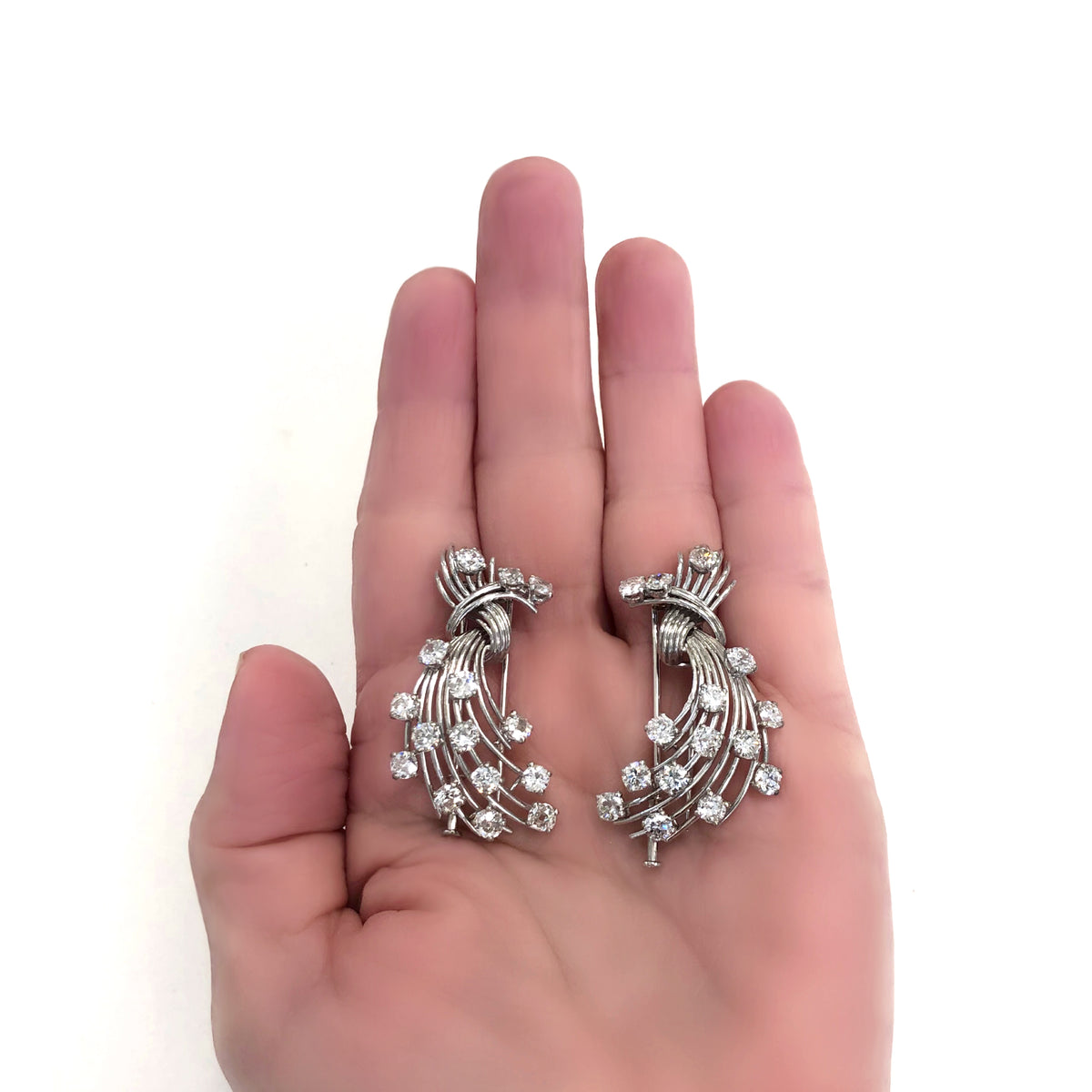 Signed Mauboussin Paris Pair of Clips in Platinum and 18k hand model view