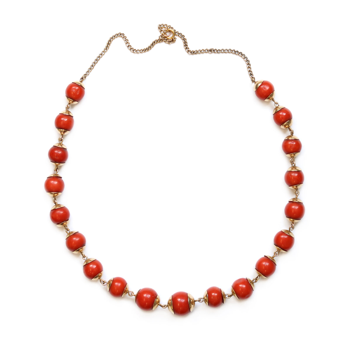 An Antique Coral Bead Station Necklace set in 14 Karat Yellow Gold top view