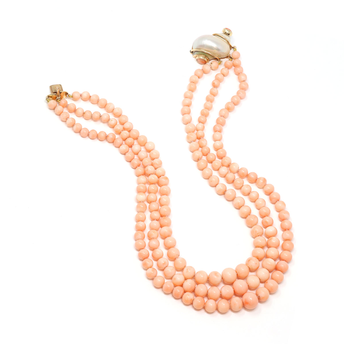 antique-1960s-angel-skin-coral-triple-strand-necklace-with-14-karat-yellow-gold-and-shell-clasp-open-clasp-view-2000x2000