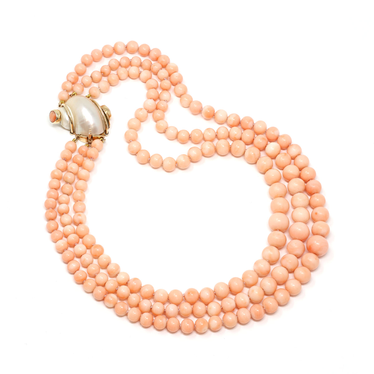 antique-1960s-angel-skin-coral-triple-strand-necklace-with-14-karat-yellow-gold-and-shell-clasp-top-view-2000x2000