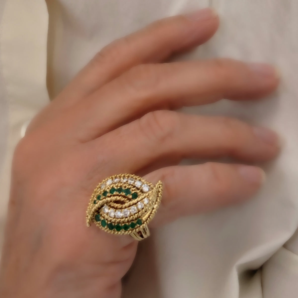 emerald and diamond cocktail ring set in 18 karat yellow gold model view