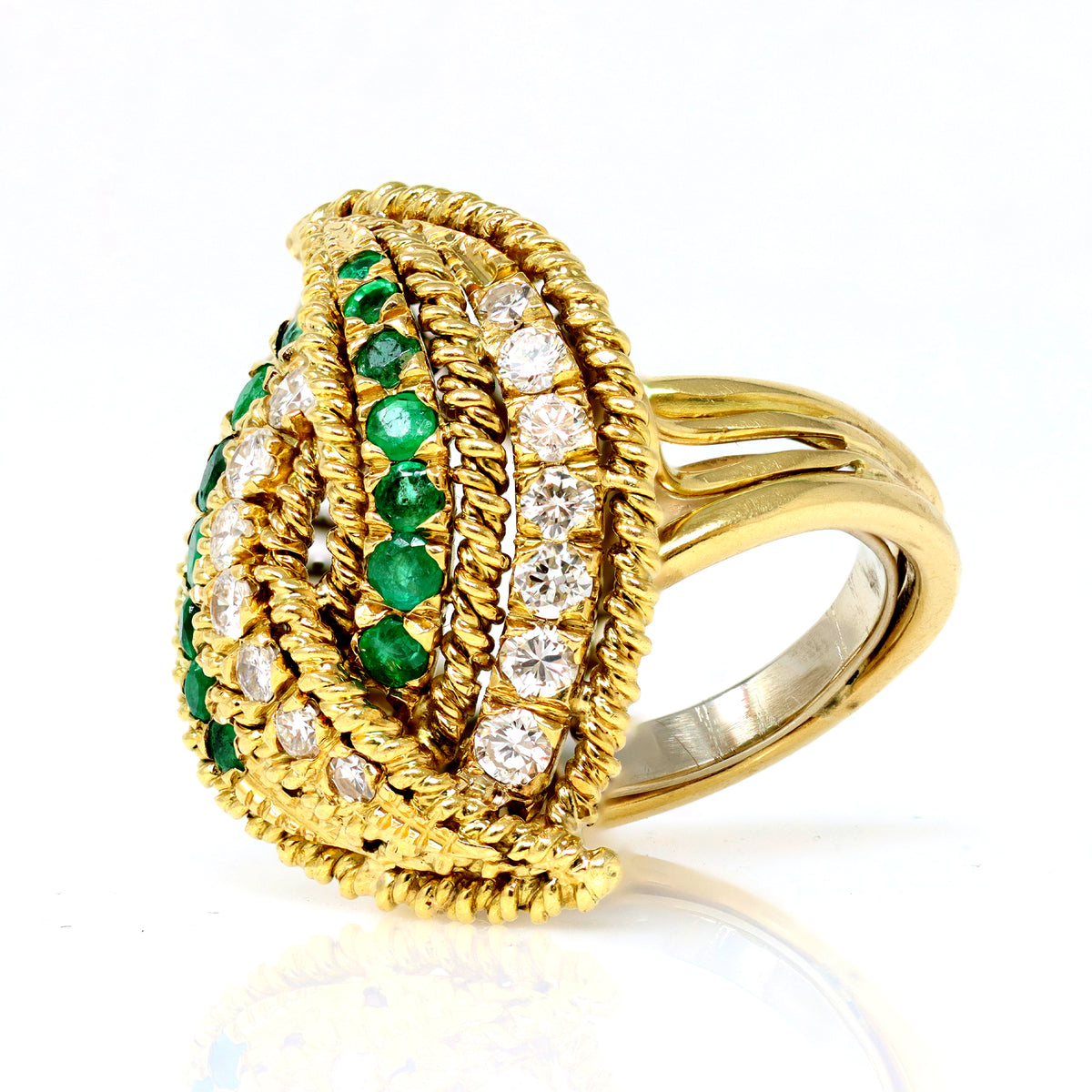 emerald and diamond cocktail ring set in 18 karat yellow gold side two view  